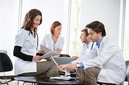 simsearch:6108-05868312,k - Doctors discussing together Stock Photo - Premium Royalty-Free, Code: 6108-05868037