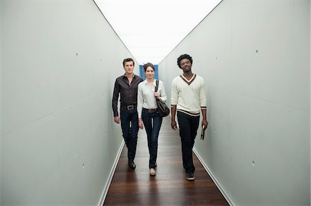 simsearch:6108-05868267,k - Business executives walking in the corridor of an office Stock Photo - Premium Royalty-Free, Code: 6108-05868281