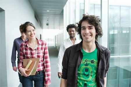 Business executives walking in an office Stock Photo - Premium Royalty-Free, Code: 6108-05868215