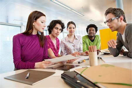 simsearch:6108-06167952,k - Business executives discussing in an office Stock Photo - Premium Royalty-Free, Code: 6108-05868544