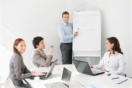 simsearch:6108-05868312,k - Businessman giving presentation in a meeting Stock Photo - Premium Royalty-Free, Code: 6108-05868528