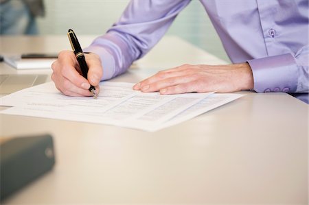 form hand - Man signing documents Stock Photo - Premium Royalty-Free, Code: 6108-05868638