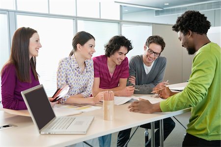 Business executives discussing in an office Stock Photo - Premium Royalty-Free, Code: 6108-05868705