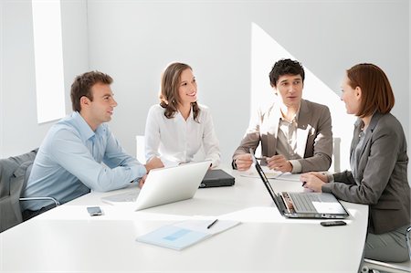 simsearch:6108-05868312,k - Business executives discussing in a meeting Stock Photo - Premium Royalty-Free, Code: 6108-05868843