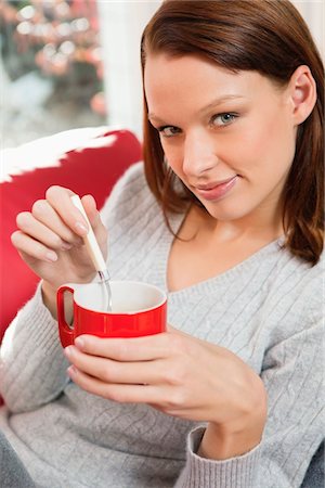 Young woman drinking coffee Stock Photo - Premium Royalty-Free, Code: 6108-05868914