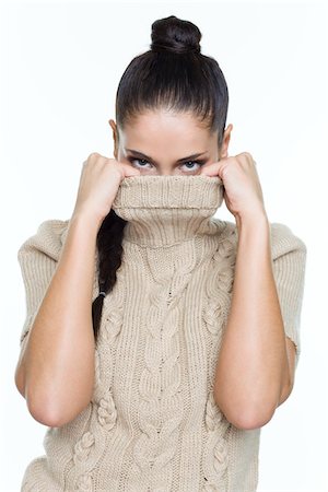 embarrassed woman - Young woman covering her face with sweater Stock Photo - Premium Royalty-Free, Code: 6108-05869044