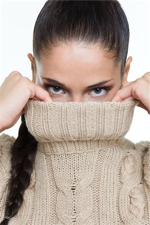 sweaters turtleneck - Young woman covering her face with sweater Stock Photo - Premium Royalty-Free, Code: 6108-05869007