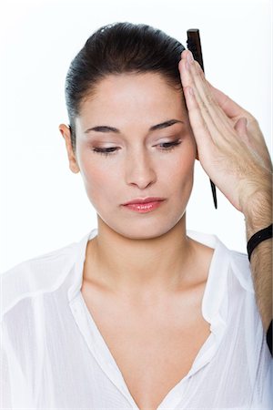 female hair stylist - Young woman getting her hair done Stock Photo - Premium Royalty-Free, Code: 6108-05869261