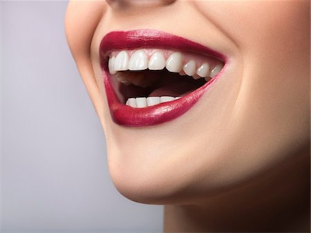 Woman laughing, close-up of mouth Foto de stock - Sin royalties Premium, Código: 6108-05869345