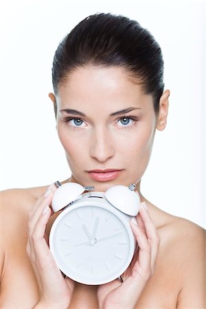 reloj (no pulsera no bolsillo) - Young woman holding alarm clock Foto de stock - Sin royalties Premium, Código: 6108-05869374