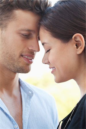 side profile face smile - Close-up of a romantic couple Stock Photo - Premium Royalty-Free, Code: 6108-05869550