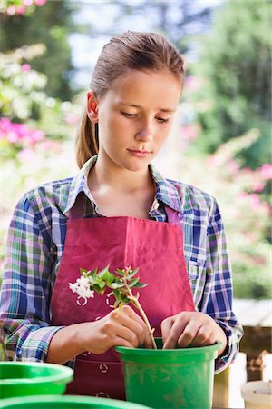 Girl gardening and thinking Stock Photo - Premium Royalty-Free, Code: 6108-05869515