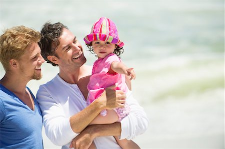 family lifestyle and friends not eye contact - Man carrying his daughter pointing Stock Photo - Premium Royalty-Free, Code: 6108-05869666