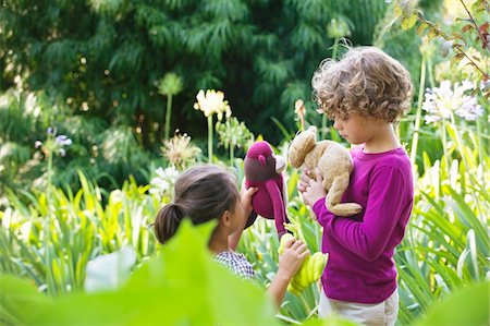 simsearch:6108-05869491,k - Cute little boy standing with little girl in a garden Stock Photo - Premium Royalty-Free, Code: 6108-05869739