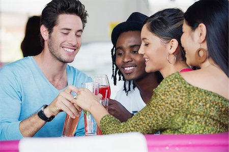 simsearch:6108-06907737,k - Friends toasting drinks in a restaurant Stock Photo - Premium Royalty-Free, Code: 6108-05869846