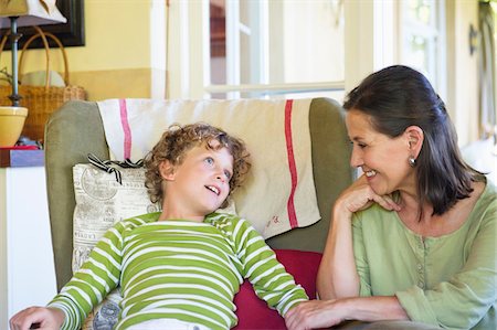 side view relaxing couch - Grandmother and little boy sitting together at home Stock Photo - Premium Royalty-Free, Code: 6108-05870145