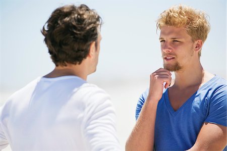 Two men talking to each other Stock Photo - Premium Royalty-Free, Code: 6108-05870369