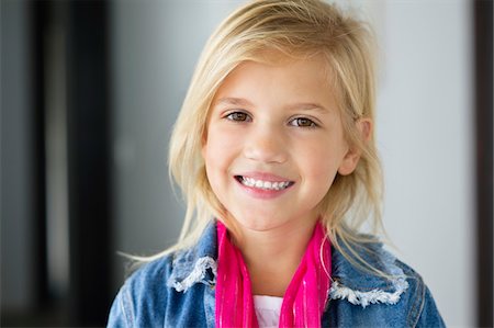 Portrait of a cute little girl smiling Stock Photo - Premium Royalty-Free, Code: 6108-05870592