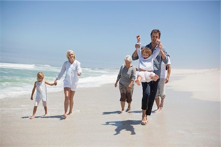 family outdoor walking and grandparents - Family enjoying on the beach Stock Photo - Premium Royalty-Free, Code: 6108-05870816