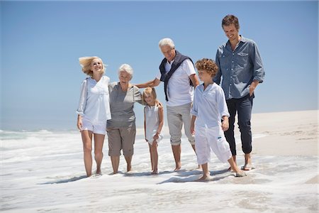 simsearch:6108-06905893,k - Family enjoying on the beach Stock Photo - Premium Royalty-Free, Code: 6108-05870820