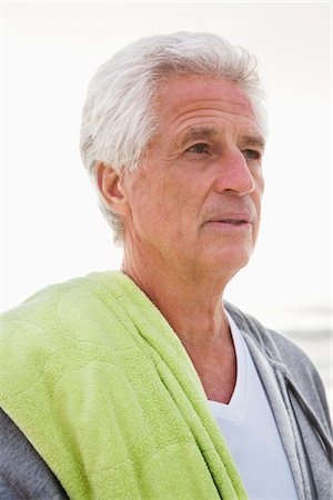 Close-up of a senior man at beach Stock Photo - Premium Royalty-Free, Code: 6108-05870966