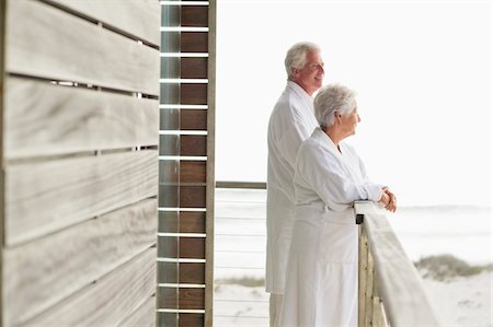 Senior couple standing at a balcony Stock Photo - Premium Royalty-Free, Code: 6108-05870989