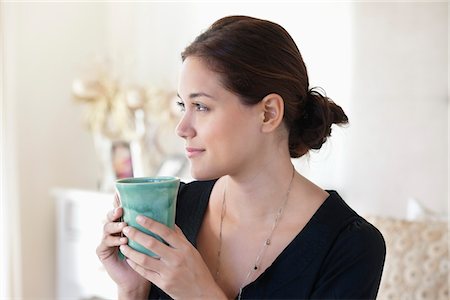 drinking tea - Young woman drinking tea at home Stock Photo - Premium Royalty-Free, Code: 6108-05871155