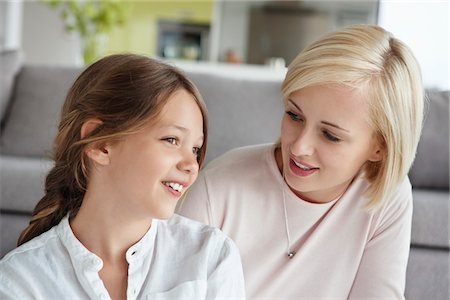 parent tween discusses - Woman looking at daughter and smiling Stock Photo - Premium Royalty-Free, Code: 6108-05871207