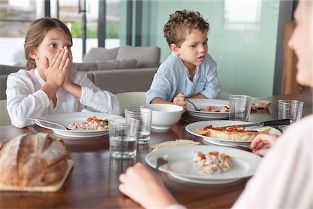 shocked eating - Family having food Stock Photo - Premium Royalty-Free, Code: 6108-05871236