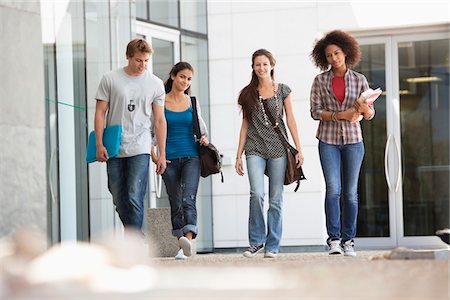 diversity in college campuses - University students walking in a campus Stock Photo - Premium Royalty-Free, Code: 6108-05871303