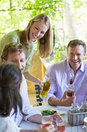 friends porch - Happy family having drink at home Stock Photo - Premium Royalty-Free, Code: 6108-05871963