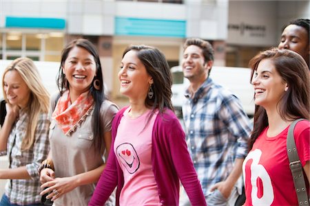friends in city - Smiling friends walking together Stock Photo - Premium Royalty-Free, Code: 6108-05872138