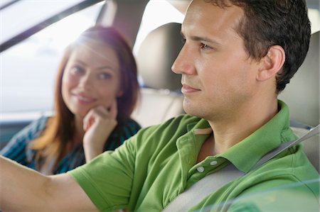 Happy couple driving a car Stock Photo - Premium Royalty-Free, Code: 6108-05872255