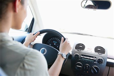 dashboard in car - Young woman driving a car Stock Photo - Premium Royalty-Free, Code: 6108-05872203