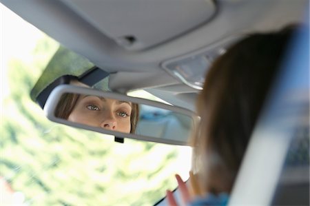 simsearch:6108-05872252,k - Reflection of a young woman eyes in rear-view mirror Foto de stock - Sin royalties Premium, Código: 6108-05872209