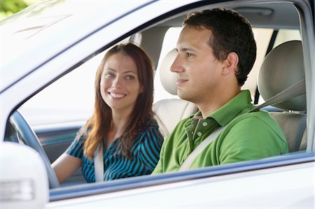 Happy couple driving a car Stock Photo - Premium Royalty-Free, Code: 6108-05872229