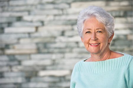 simsearch:6108-05871799,k - Portrait of a senior woman smiling Stock Photo - Premium Royalty-Free, Code: 6108-05872345