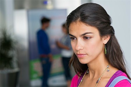 simsearch:6108-06905197,k - Close-up of a female university student looking serious Stock Photo - Premium Royalty-Free, Code: 6108-05872338