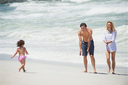 romantic wave seashore - Happy family playing on the beach Stock Photo - Premium Royalty-Free, Code: 6108-05872510