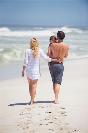 family walk sand - Family walking on the beach Stock Photo - Premium Royalty-Free, Code: 6108-05872520