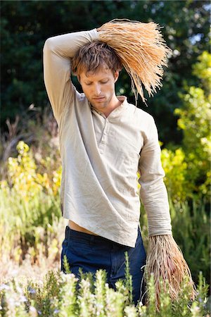 simsearch:6108-05870477,k - Bored man standing in a field as scarecrow Stock Photo - Premium Royalty-Free, Code: 6108-05872647