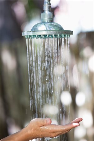 shower water - Close-up of a woman's hand under running shower Stock Photo - Premium Royalty-Free, Code: 6108-05872742