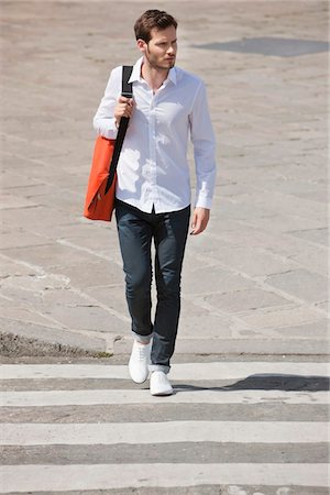 Man walking on crosswalk, Paris, Ile-de-France, France Stock Photo - Premium Royalty-Free, Code: 6108-05872870