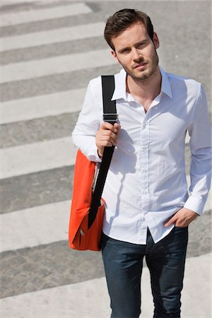 Man walking on crosswalk, Paris, Ile-de-France, France Stock Photo - Premium Royalty-Free, Code: 6108-05872889