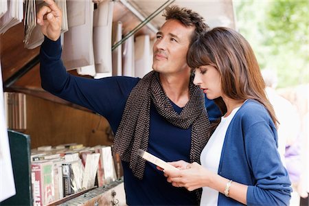 stores to shop in paris - Couple choosing books at a book stall, Paris, Ile-de-France, France Stock Photo - Premium Royalty-Free, Code: 6108-05872834