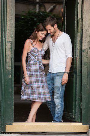Romantic couple at a doorway, Paris, Ile-de-France, France Stock Photo - Premium Royalty-Free, Code: 6108-05872946