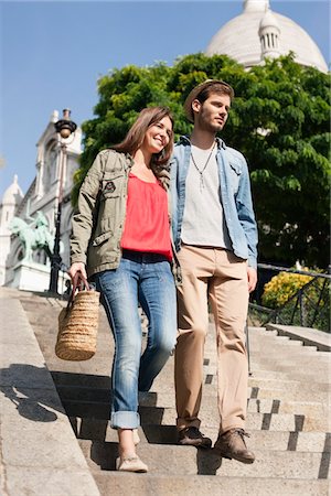 simsearch:6108-05873289,k - Couple moving down staircases, Montmartre, Paris, Ile-de-France, France Stock Photo - Premium Royalty-Free, Code: 6108-05873045