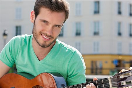 Man playing a guitar, Canal St Martin, Paris, Ile-de-France, France Stock Photo - Premium Royalty-Free, Code: 6108-05873117