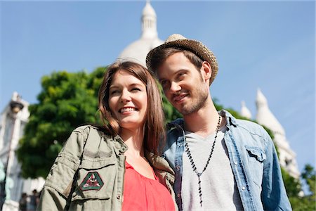 simsearch:6108-05873210,k - Low angle view of a couple smiling, Montmartre, Paris, Ile-de-France, France Stock Photo - Premium Royalty-Free, Code: 6108-05873216