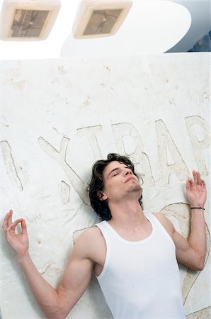simsearch:6108-05858471,k - Man in yoga position, close eyes Stock Photo - Premium Royalty-Free, Code: 6108-05873343